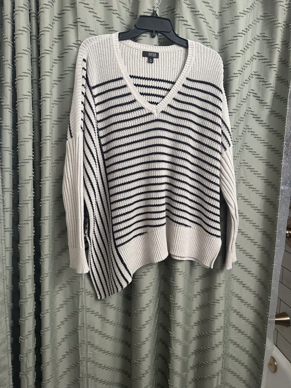 ANA sweater v-neck size XL 
Asymmetrical, striped, super cute and flattering
Tag